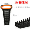 Black heavy-duty wrench organizer tray with orange handle and various sized wrench inserts for workshop storage