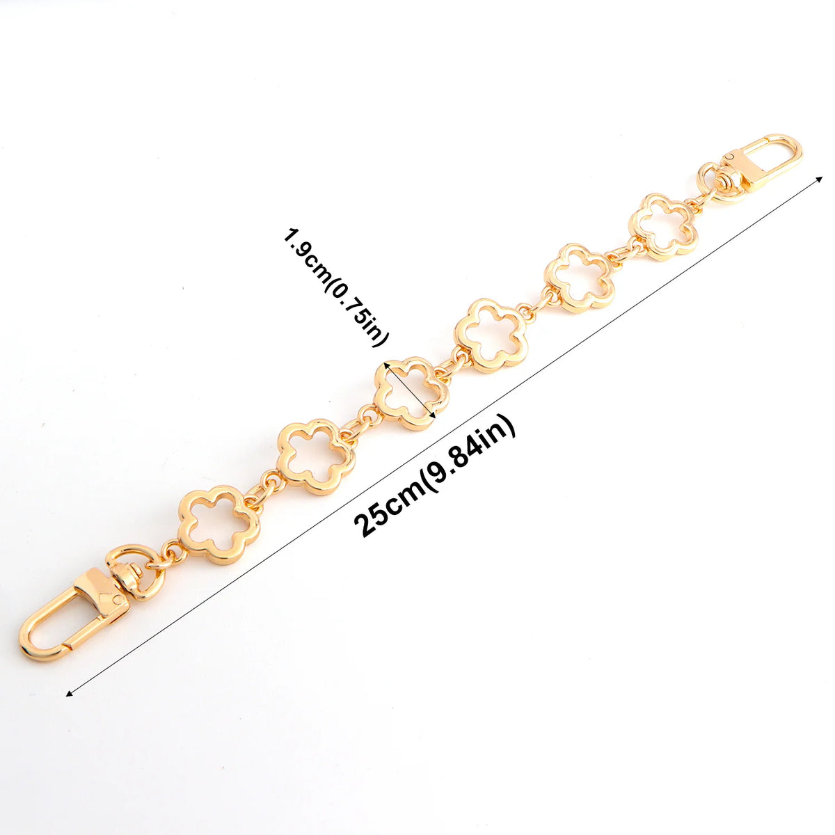 Gold adjustable flower bag chain extender measuring 25cm with a lobster clasp and decorative flowers.