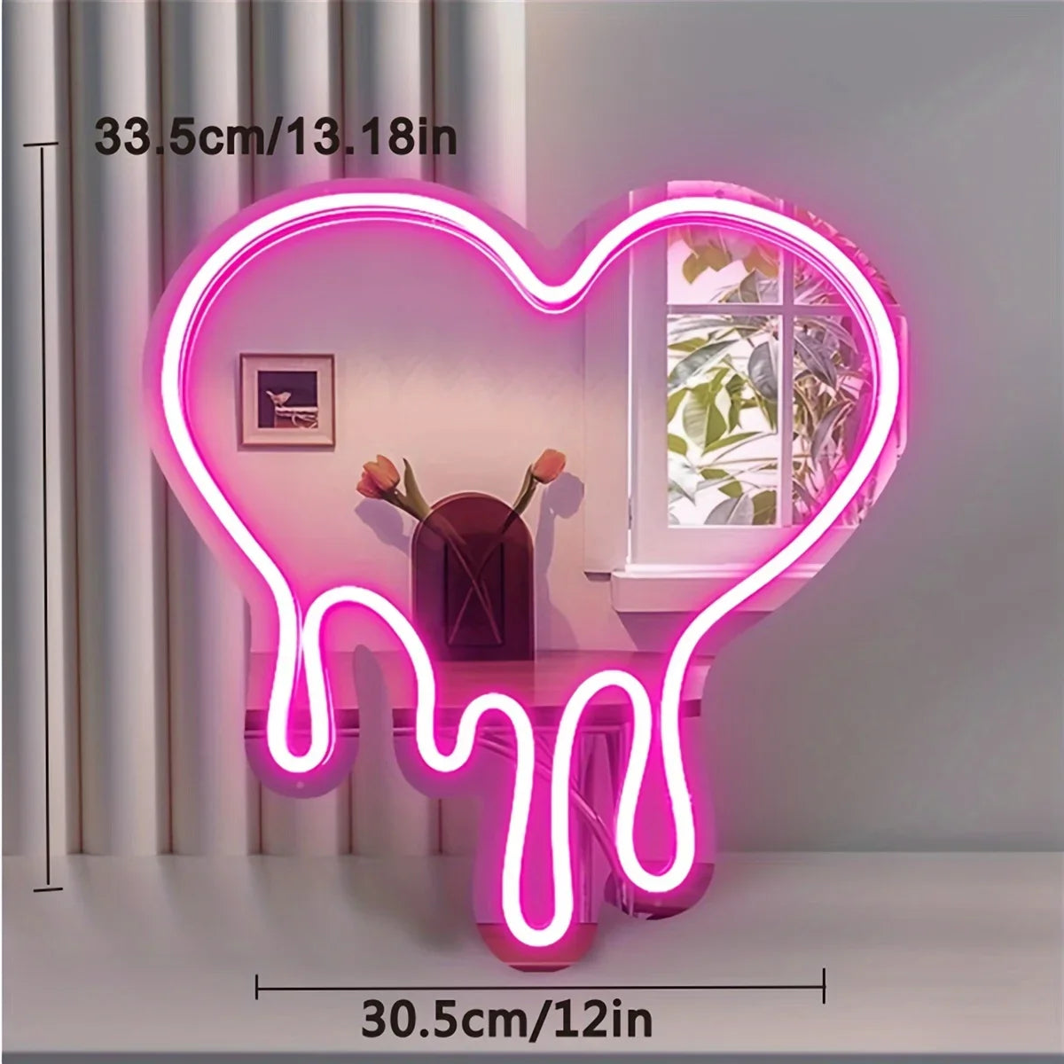 A neon sign shaped like a melting heart illuminates a pink and purple liquid effect on a white table.