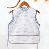 White waterproof full-body baby feeding bib with a sleeveless design featuring light blue and beige fish patterns