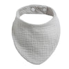 A light gray organic cotton muslin baby bib with an absorbent band around the neck.