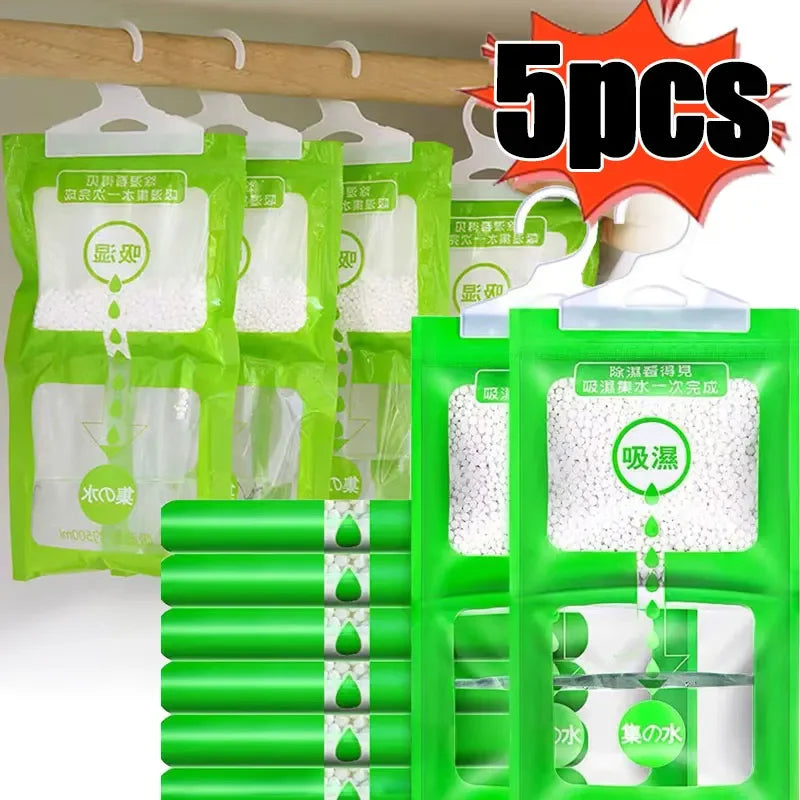 Five packs of hanging moisture absorber bags in green and white, designed for closets and cabinets.