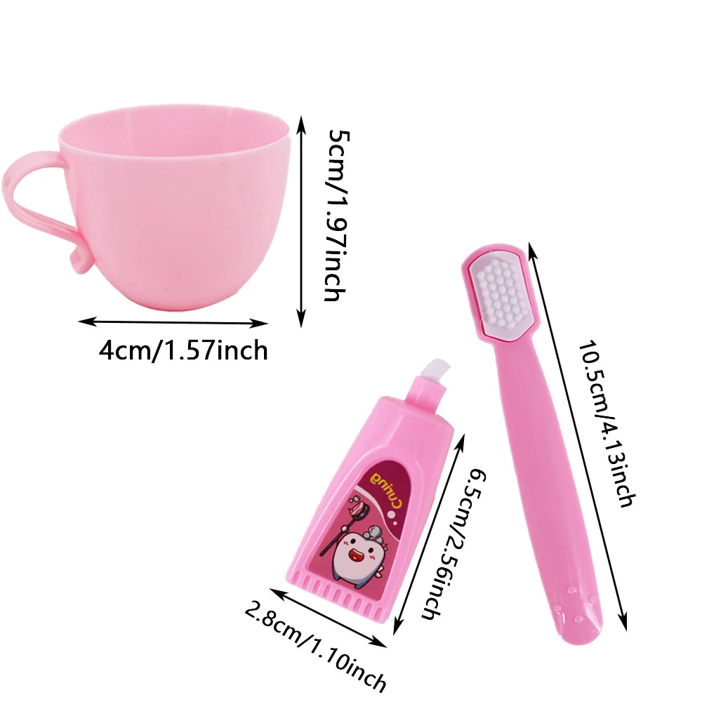 A pink doll outfit set including a jumpsuit, hat, and socks with measuring tools.