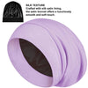 A rolled lavender silk satin sleep bonnet showing the smooth texture of the fabric.