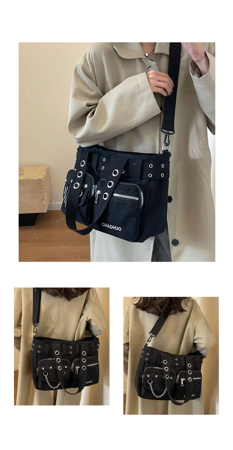 A black nylon shoulder bag with chain accents is shown being held by a person in a light beige coat.