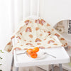 A long-sleeve waterproof baby bib with a cute animal design featuring rainbow patterns, displayed on a white table.