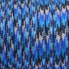 Blue and gray paracord rope wound tightly on a spool.