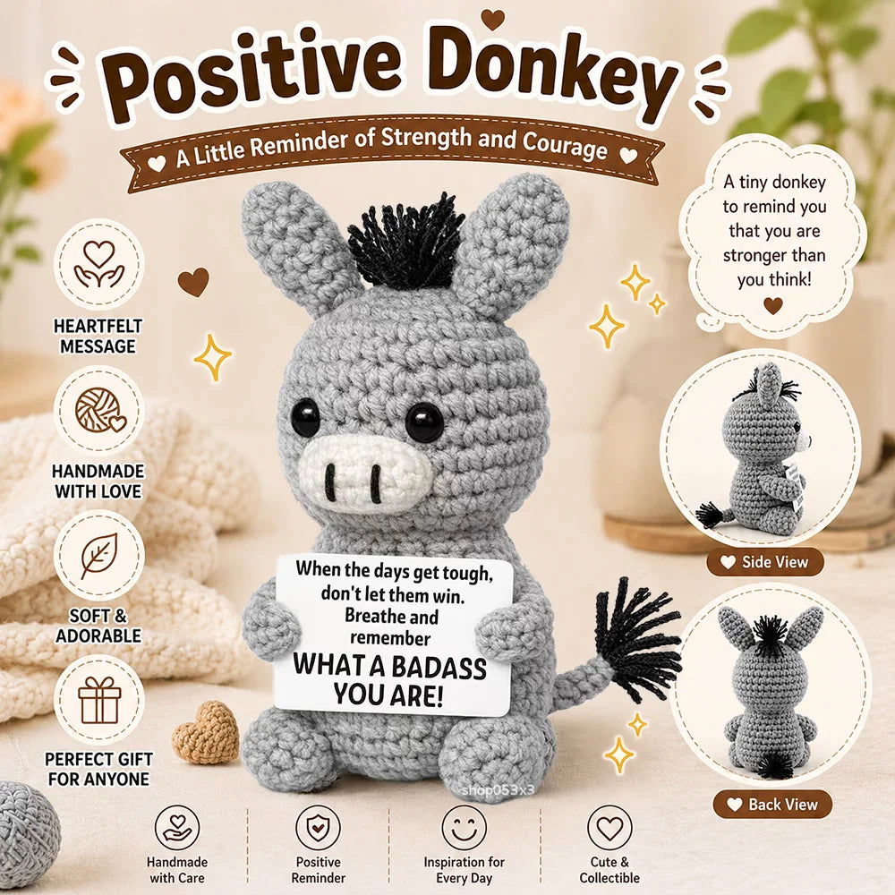 A gray crochet donkey plush toy with black hair, presented as a positive reminder of strength and courage.