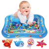 A baby is playing on a blue inflatable water mat featuring colorful fish and sea creatures.