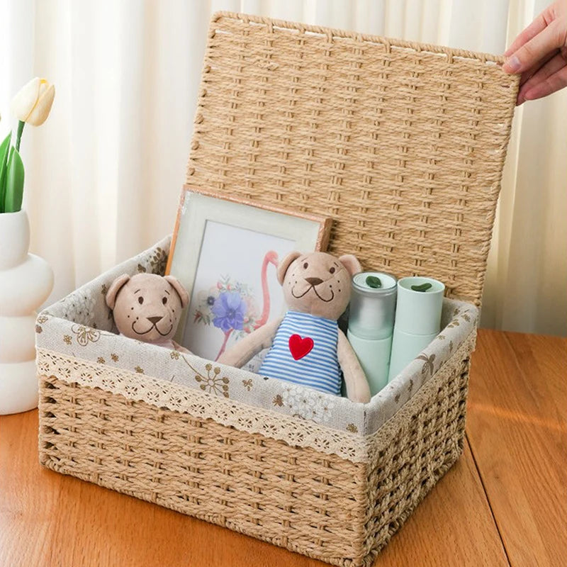 A handwoven rattan storage basket with a lid holds stuffed animals and a framed picture.