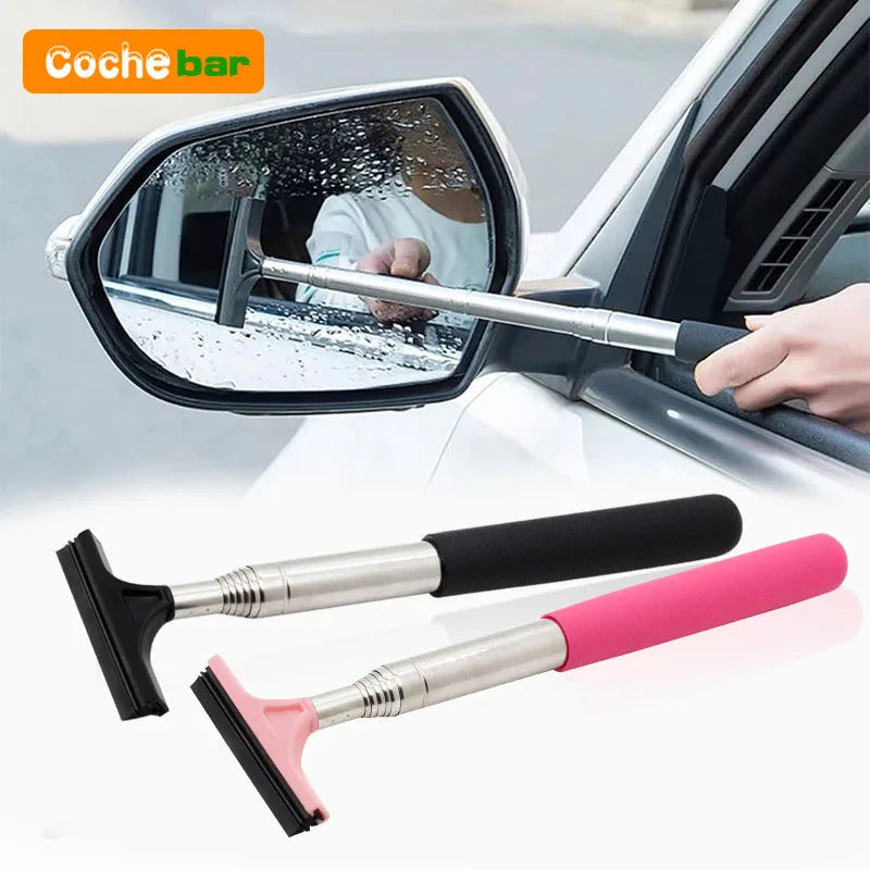 A silver retractable car mirror and window cleaning wiper is shown being used on a vehicle's side mirror.