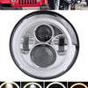 A clear plastic 7-inch motorcycle LED headlight assembly with angel eyes and daytime running lights.