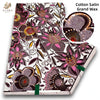 Cotton Satin Grand Wax fabric featuring a pink and purple floral African wax print design