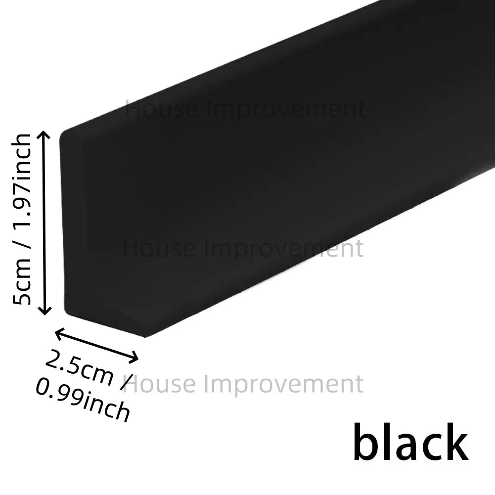 A black flexible silicone shower threshold water dam used for bathroom dry-wet separation.