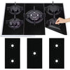 A set of three black reusable heat-resistant gas stove protector mats shown in various angles.