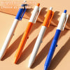 Five brightly colored pens, blue and orange, are displayed on a beige surface.