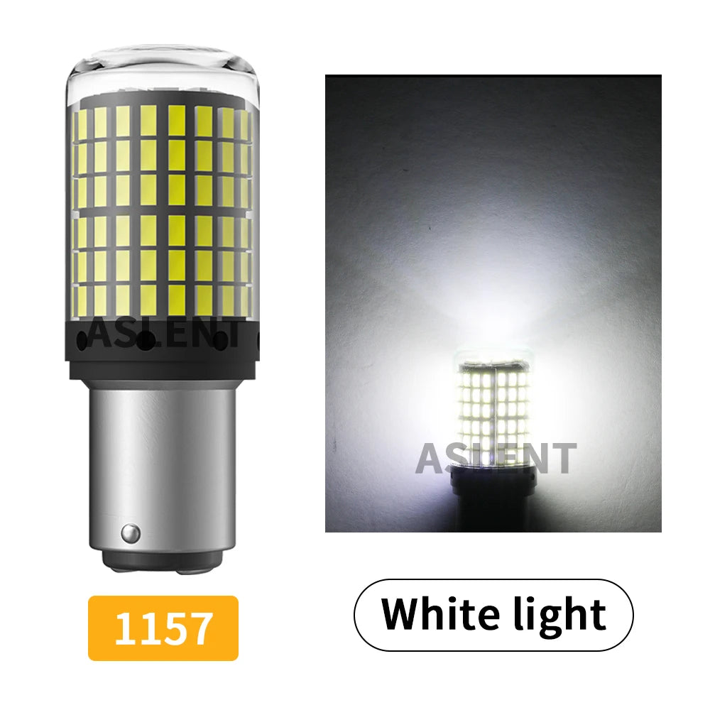 A close-up view of a white LED light bulb with a clear lens and multiple yellow LEDs, shown next to a bright light source.