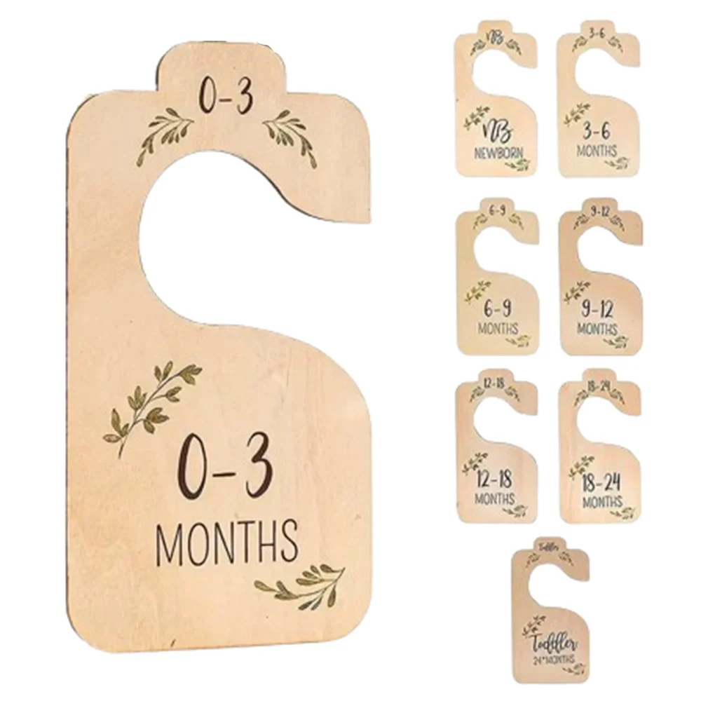 Set of wooden baby closet dividers with cartoon labels for 0-3 months and 3-12 months.