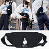 Black linen waist pack with a hand gesture design shown in various contexts.