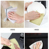 A set of lint-free microfiber cleaning cloths being used for various household cleaning tasks like dusting and wiping.