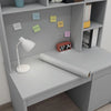 A roll of self-adhesive peel-and-stick wallpaper displayed on a light gray shelf with small sticky notes.