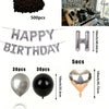 A kit for a balloon garland featuring black and silver balloons and oversized foil numbers.