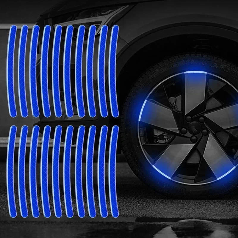 Blue reflective vertical stripes and a bright blue wheel hub sticker set on a car tire.
