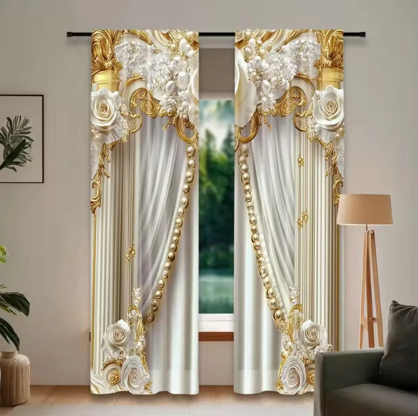 A pair of elegant white and gold light-filtering curtains with ornate floral detailing hanging in a doorway.