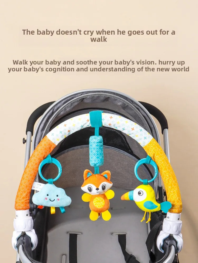 A baby stroller arch toy featuring hanging plush charms for soothing a baby's vision and cognition.