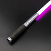 A close-up view of a Neo Pixel lightsaber with a smooth swing and an illuminated purple blade resting on a dark surface.