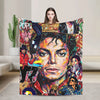 A graphic plush throw blanket featuring a collage of Michael Jackson imagery and vibrant colors.