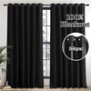 Blackout curtain panels with grommet top shown hanging in a window frame.
