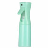 A mint green refillable mist spray bottle with a hinged nozzle for hair, skin, or home use.
