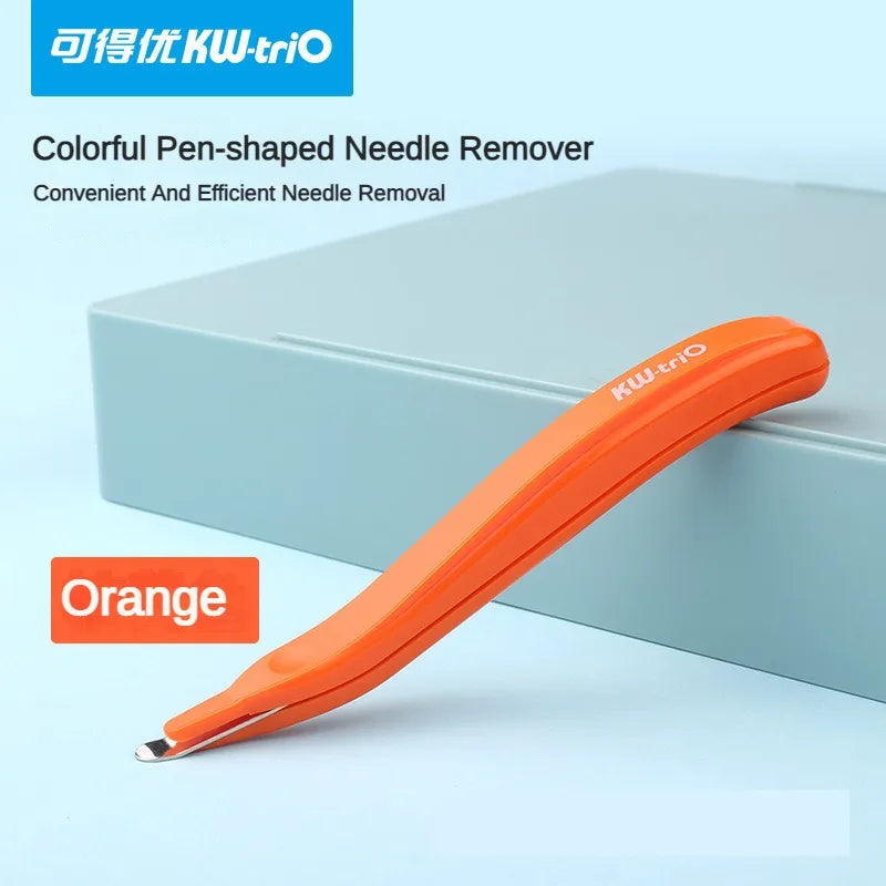 Orange pen-shaped needle remover tool resting on a light blue box.