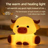 A yellow silicone night light shaped like a Highland cow, emitting a warm and healing light.