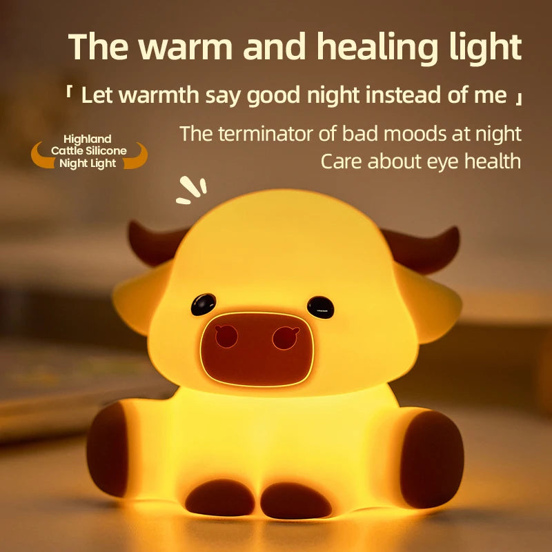 A yellow silicone night light shaped like a Highland cow, emitting a warm and healing light.