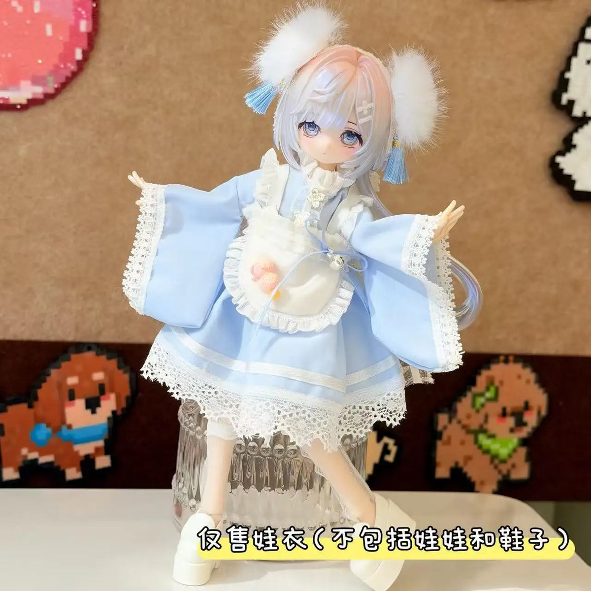 A detailed photograph of a sweet maid dress outfit for a 1/8 or 1/12 BJD doll, featuring light blue and white fabric with lac