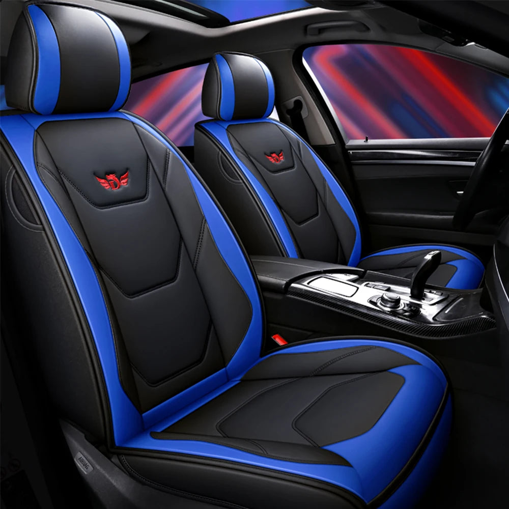 Black and blue leather car seat covers with airbags, shown inside a vehicle cabin.