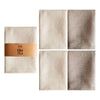 A set of four beige waffle weave towels arranged in a 2x2 grid.