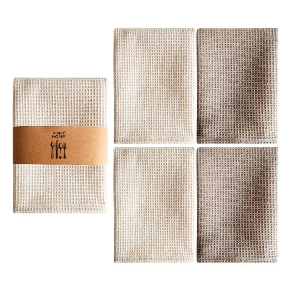 A set of four beige waffle weave towels arranged in a 2x2 grid.