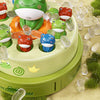 A colorful game featuring various frog figures in a green and orange tray with clear plastic elements.