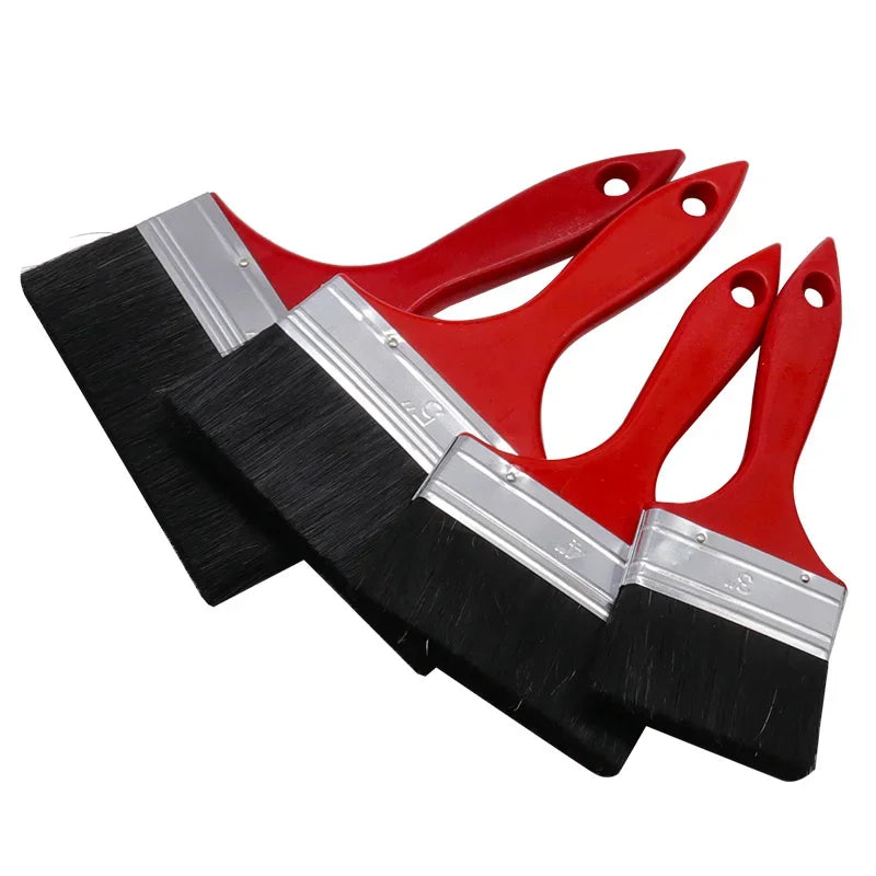 A set of versatile paint brushes featuring black bristles and red plastic handles.