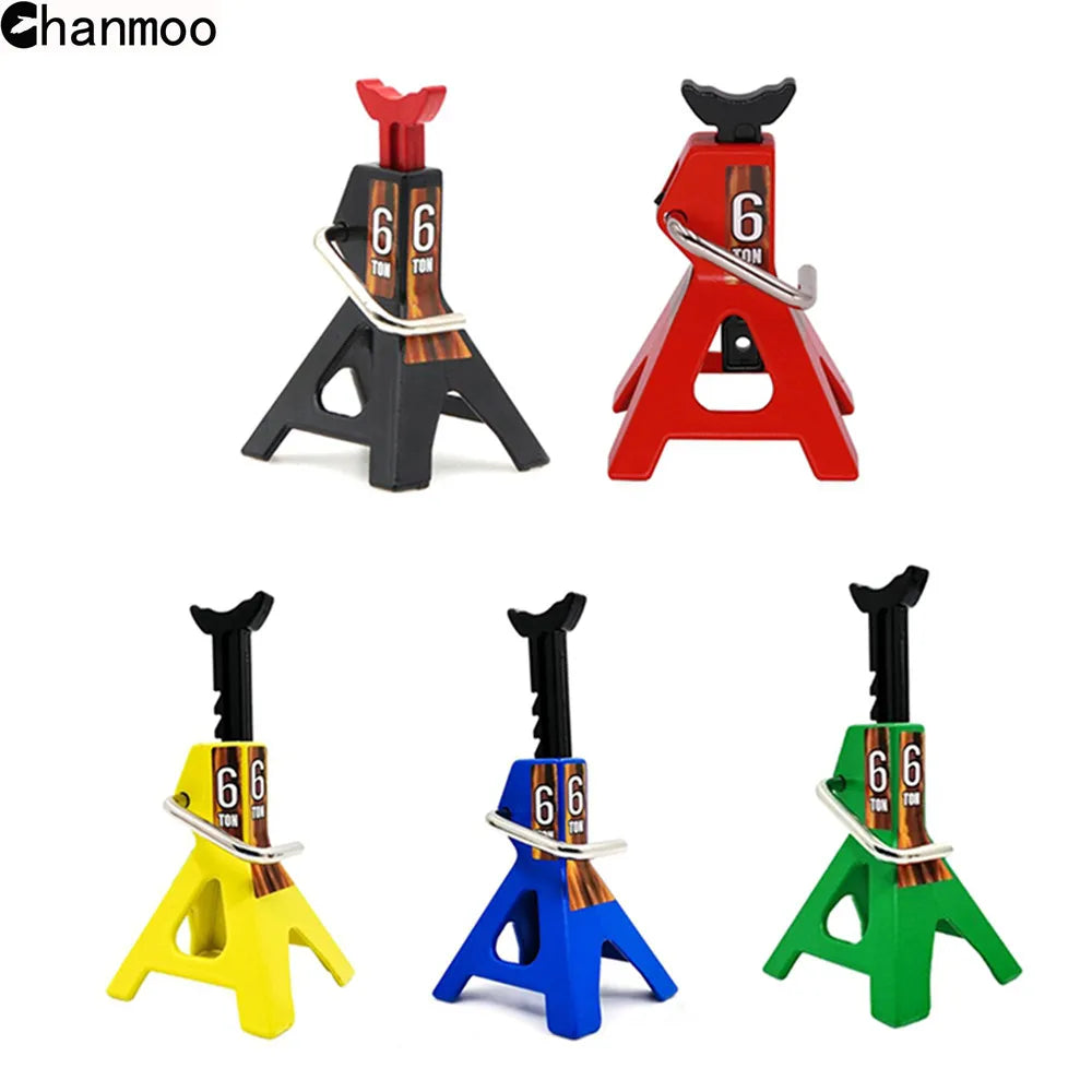A set of two heavy-duty metal car jack stands used for lifting 1/10 scale RC crawlers, shown in black, red, and yellow.