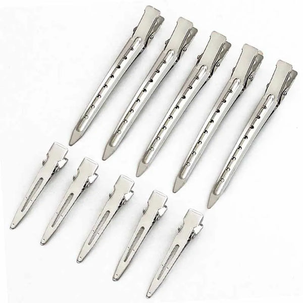 A set of professional hair curling clips in silver metal.