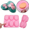 A pink silicone mold with six cavities is shown alongside a green floral silicone mold and a hand using the pink mold.