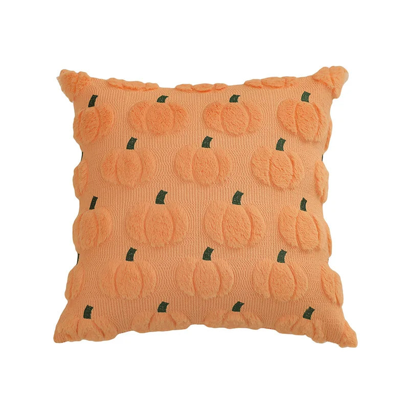Orange plush throw pillow covers patterned with small green pumpkin shapes