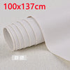 A roll of white self-adhesive PU leather patch measuring 100x137cm shown on a light fabric background.