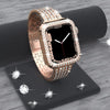 Apple Watch tono dorado con carcasa de rhinestone brillante, mostrada sobre una superficie oscura.