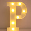 A glowing yellow LED letter P night light with illuminated dots, used for home and party decor.