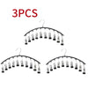 Three metal pant hangers with hooks and clips displayed against a white background.